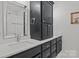 Stylish bathroom featuring a modern vanity with double sinks, quartz counters, and a dark-toned cabinet at 213 Genesis Pl, Cleveland, NC 27013