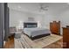Comfortable bedroom featuring hardwood floors, natural light from the windows and a ceiling fan at 213 Genesis Pl, Cleveland, NC 27013