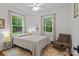 Cozy bedroom with hardwood floors, natural light, a ceiling fan, and tasteful decor at 213 Genesis Pl, Cleveland, NC 27013
