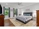 Comfortable bedroom featuring hardwood floors, natural light from the windows and a ceiling fan at 213 Genesis Pl, Cleveland, NC 27013
