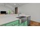 Kitchen sink with stainless steel hardware and cabinets overlooking the living area at 213 Genesis Pl, Cleveland, NC 27013