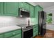 Well-appointed kitchen with stainless steel appliances and generous green cabinet storage at 213 Genesis Pl, Cleveland, NC 27013