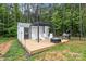 Outdoor space featuring a stylish pergola, a cozy fire pit, and comfortable Adirondack chairs on a wooden deck at 213 Genesis Pl, Cleveland, NC 27013
