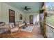 Inviting screened porch with a cozy seating area, perfect for enjoying the outdoors in comfort and style at 213 Genesis Pl, Cleveland, NC 27013