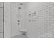 Contemporary shower featuring subway tile, a built-in seat, and niche shelving at 213 Genesis Pl, Cleveland, NC 27013