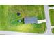 Aerial view featuring lush backyard, trampoline, hardtop gazebo, and home's roof at 2411 28Th Ne St, Hickory, NC 28601