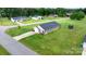 Aerial view featuring the home, long driveway, spacious lawn with trampoline and home's exterior at 2411 28Th Ne St, Hickory, NC 28601