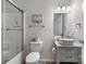 Well-lit bathroom featuring a vanity and glass-enclosed bathtub at 2411 28Th Ne St, Hickory, NC 28601