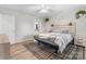 Bright bedroom featuring a stylish headboard, ceiling fan, and neutral decor at 2411 28Th Ne St, Hickory, NC 28601