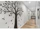 Well-lit hallway featuring contemporary design elements and access to various rooms throughout the home at 2411 28Th Ne St, Hickory, NC 28601