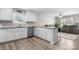 Modern kitchen with stainless steel appliances, granite countertops, and an open view into the living area at 2411 28Th Ne St, Hickory, NC 28601