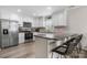 Modern kitchen with stainless steel appliances, granite countertops, and breakfast bar seating for casual dining at 2411 28Th Ne St, Hickory, NC 28601
