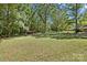 Expansive backyard with mature trees and a large lawn, offering plenty of space for outdoor activities and relaxation at 2522 Doster Rd, Monroe, NC 28112