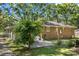 The backyard features a paved patio, mature trees, and a well-maintained lawn, creating a tranquil outdoor retreat at 2522 Doster Rd, Monroe, NC 28112