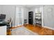 Comfortable bedroom with hardwood floors, a ceiling fan and two windows offering natural light at 2522 Doster Rd, Monroe, NC 28112