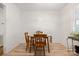 Minimalist dining room featuring hardwood floors and natural light through window at 2522 Doster Rd, Monroe, NC 28112