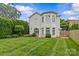 Expansive backyard with a lush lawn and mature trees and landscaping offers a private outdoor space at 2814 Glendale Rd, Charlotte, NC 28209