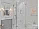 Modern bathroom features a glass shower, white subway tiles, and a marble-topped vanity at 2814 Glendale Rd, Charlotte, NC 28209