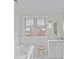 Charming bathroom featuring wainscoting, a soaking tub, and stylish fixtures at 2814 Glendale Rd, Charlotte, NC 28209