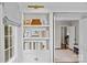 Custom built-in bookcase with natural light that adds a touch of elegance at 2814 Glendale Rd, Charlotte, NC 28209