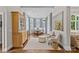 Bright dining room features a bay window, elegant chandelier, and refined decor at 2814 Glendale Rd, Charlotte, NC 28209