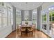 Bright dining room with bay windows, shutters, and a classic chandelier at 2814 Glendale Rd, Charlotte, NC 28209