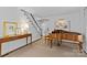 Inviting entryway with hardwood floors, grand piano, and elegant staircase at 2814 Glendale Rd, Charlotte, NC 28209
