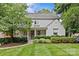 Charming two-story home with manicured lawn and lush landscaping creating inviting curb appeal at 2814 Glendale Rd, Charlotte, NC 28209