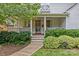 Inviting front porch with classic columns, brick steps, and professional landscaping at 2814 Glendale Rd, Charlotte, NC 28209