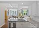 Bright kitchen with a marble countertop, and ample cabinets and counter space at 2814 Glendale Rd, Charlotte, NC 28209