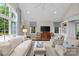 Bright living room with high ceilings, a large window, and a cozy seating arrangement at 2814 Glendale Rd, Charlotte, NC 28209