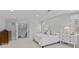 Bright main bedroom featuring a plush bed, an ensuite, and natural light at 2814 Glendale Rd, Charlotte, NC 28209