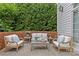 Inviting brick patio with comfortable seating, perfect for relaxing and enjoying the serene outdoor space at 2814 Glendale Rd, Charlotte, NC 28209