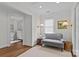 Cozy sitting room with neutral paint, hardwood floors, area rug, and a window with natural light at 2814 Glendale Rd, Charlotte, NC 28209