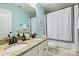 Bathroom with dual sinks, granite counters, and shower curtain at 2844 Georgia Ave, Charlotte, NC 28205
