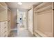 Walk-in closet with built-in shelving and access to bathroom at 2844 Georgia Ave, Charlotte, NC 28205