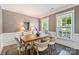 Well-lit dining room with a wooden table and neutral-toned walls at 2844 Georgia Ave, Charlotte, NC 28205
