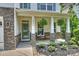 Charming front porch with stone accents, hanging ferns, and seating area offers a welcoming entrance at 2844 Georgia Ave, Charlotte, NC 28205