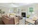 Cozy living room with fireplace and lots of natural light at 2844 Georgia Ave, Charlotte, NC 28205