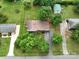 A beautiful aerial view of a home with a long driveway and lush greenery at 318 Confederate Sw Dr, Concord, NC 28027