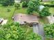 Aerial shot showcasing a home with a long driveway and a well-manicured lawn at 318 Confederate Sw Dr, Concord, NC 28027