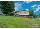 Sprawling backyard with mature trees and a well maintained lawn at 318 Confederate Sw Dr, Concord, NC 28027