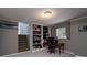 Finished basement area with built in shelving, office area, and carpet at 318 Confederate Sw Dr, Concord, NC 28027