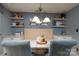 Dining area with white built-in bench seating, updated lighting and wall shelves at 318 Confederate Sw Dr, Concord, NC 28027