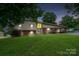 Two-story home with a carport and lush front lawn at 318 Confederate Sw Dr, Concord, NC 28027