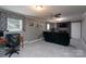 Relaxing living room with brick fireplace, ceiling fan, and neutral carpet at 318 Confederate Sw Dr, Concord, NC 28027
