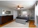 Spacious main bedroom with a ceiling fan, hardwood flooring, a double door closet, and an ensuite bathroom at 318 Confederate Sw Dr, Concord, NC 28027