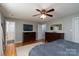 This well-lit main bedroom boasts hardwood floors and access to an ensuite bathroom for added convenience at 318 Confederate Sw Dr, Concord, NC 28027