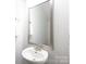 Elegant half-bathroom featuring a stylish vessel sink, modern faucet, and a sleek, framed mirror at 3403 Keith Dr, Charlotte, NC 28269