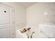 Bright bathroom with a soaking tub, perfect for relaxation and featuring stylish marble accents at 3403 Keith Dr, Charlotte, NC 28269